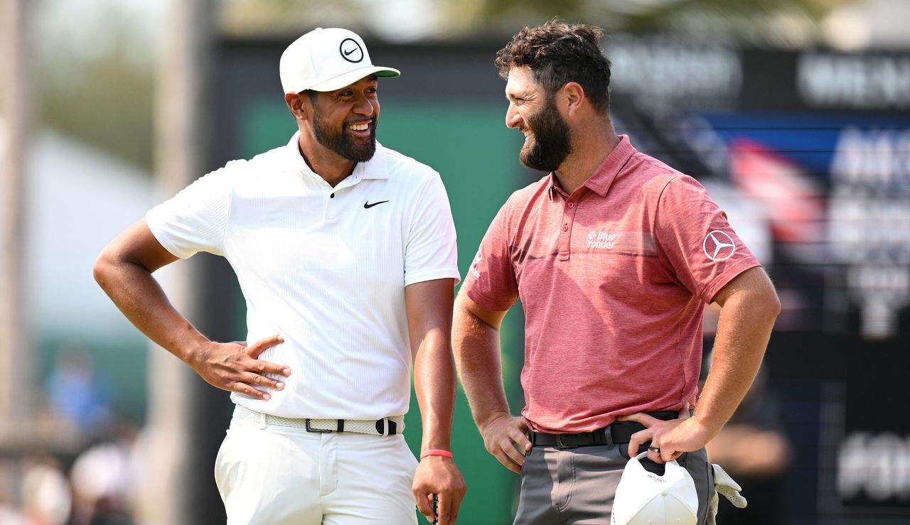 Tony Finau and Jon Rahm talking to each other