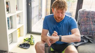 Man checking his sports watch after a workout