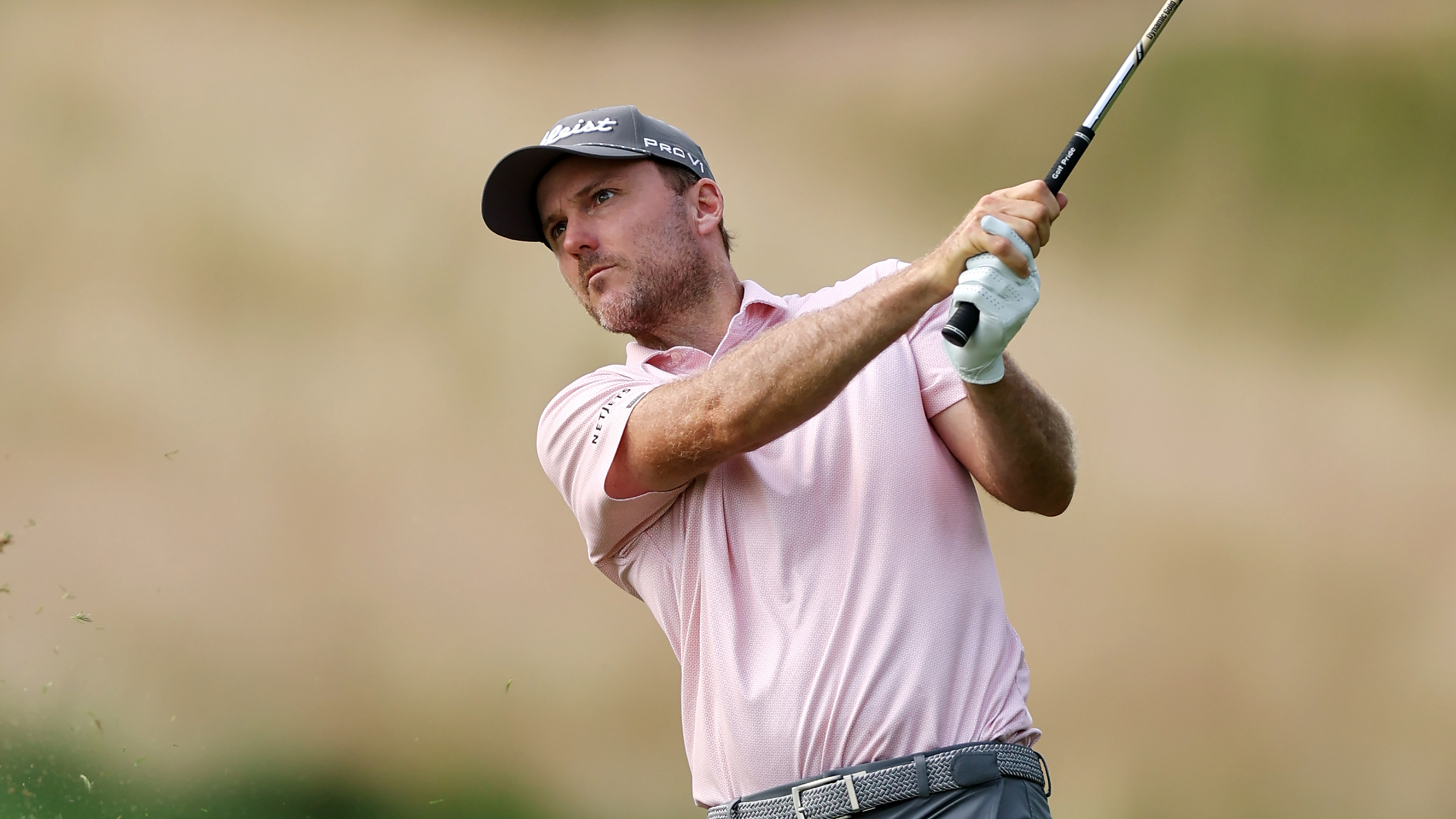 Russell Henley holds his finish on a iron shot