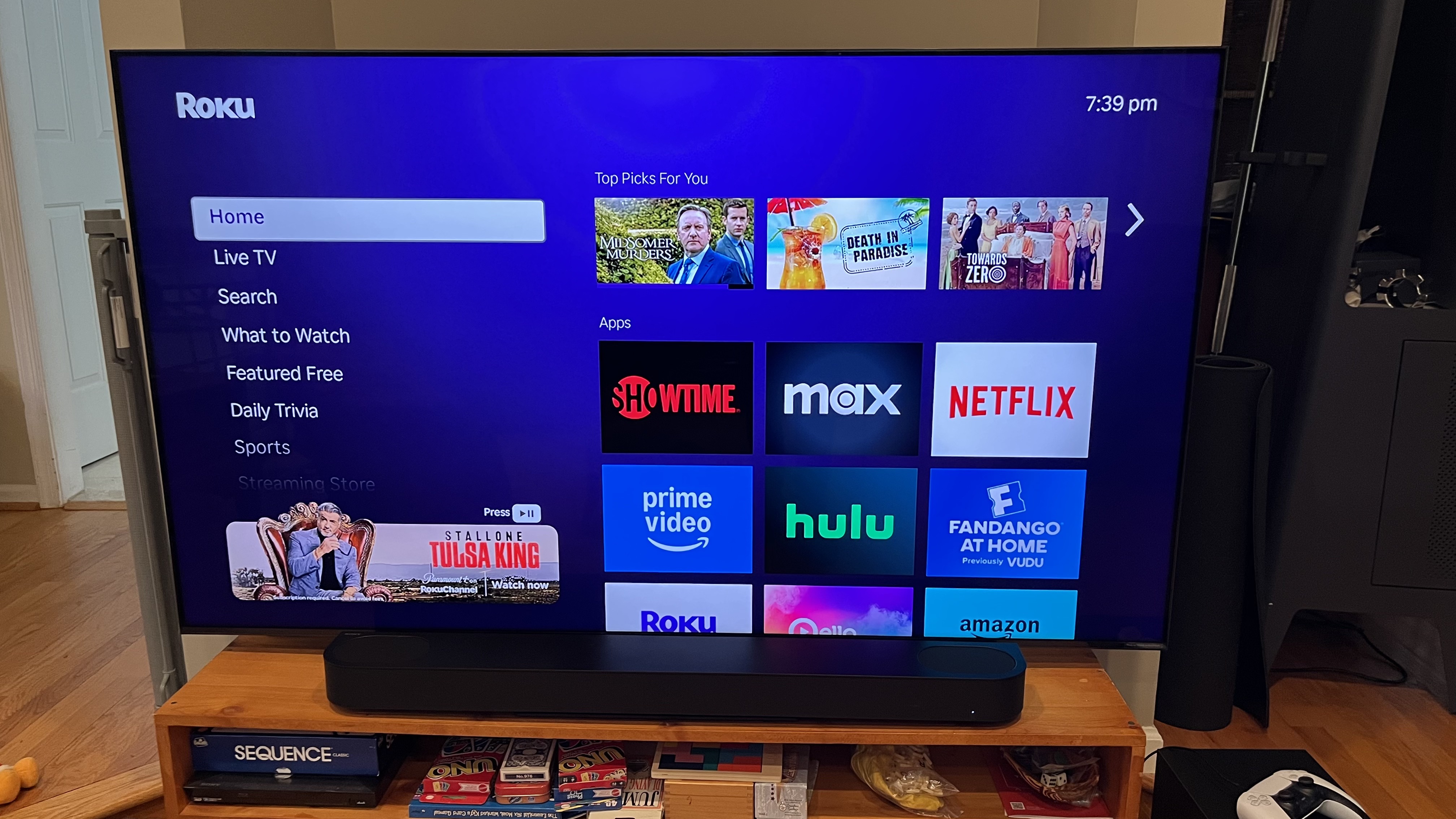 Roku TV interface shown on TV screen