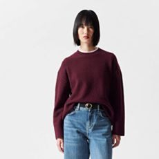 Model wearing an oversized jumper and jeans from & Other Stories