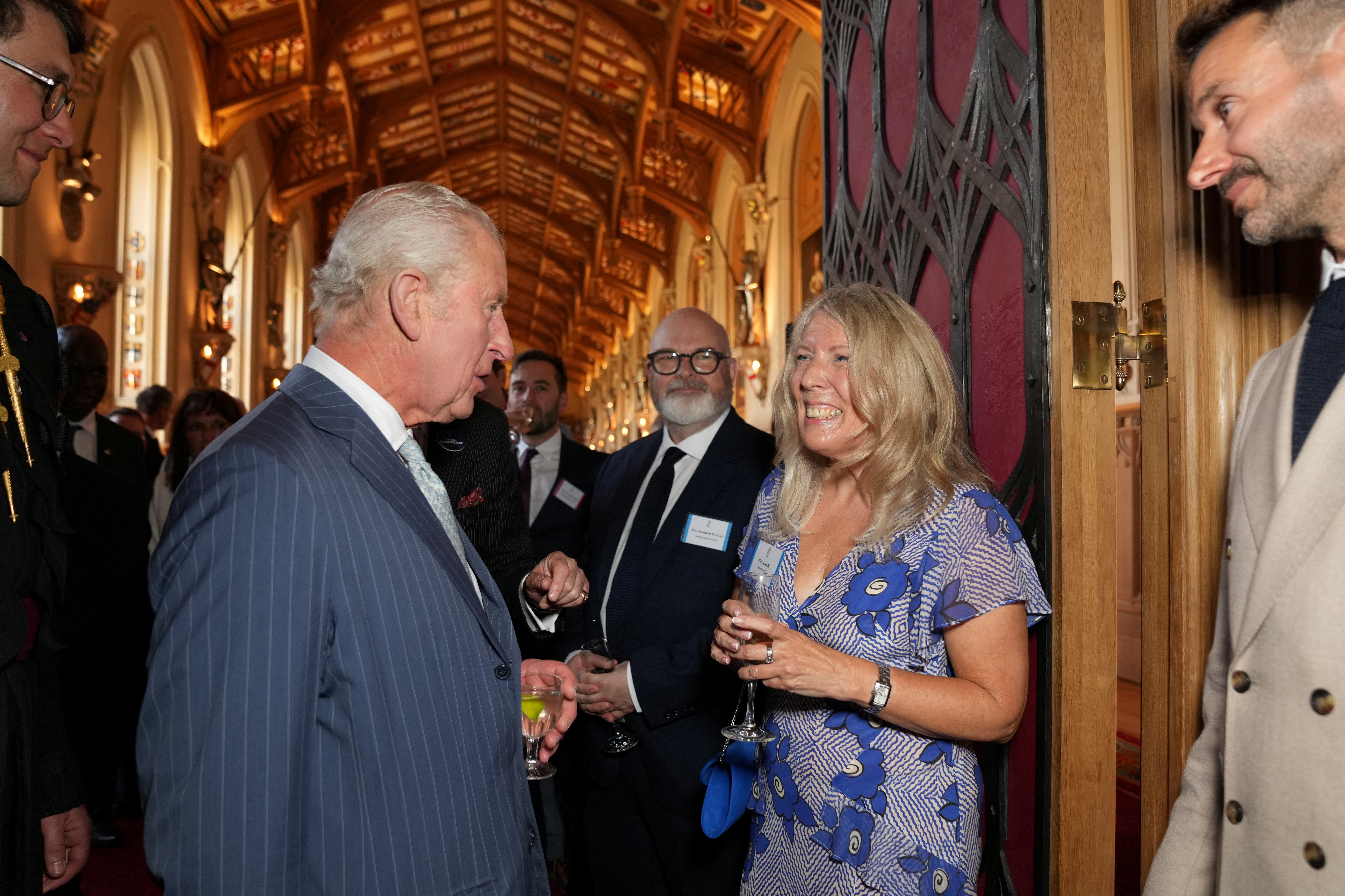 King Charles III speaks with Lisa Kay of footwear company Sole Bliss Ltd at reception for the King's Award for Enterprise at Windsor Castle on June 12, 2025