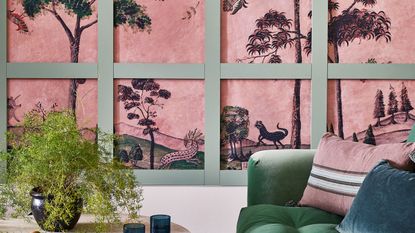 pink wall mural with green panelling and velvet sofa