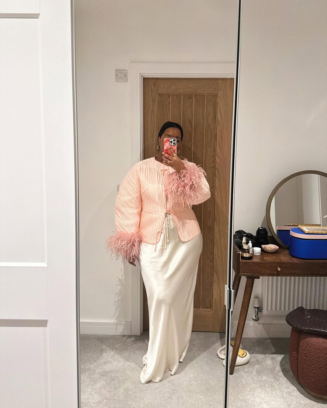 Karina in a feather jacket