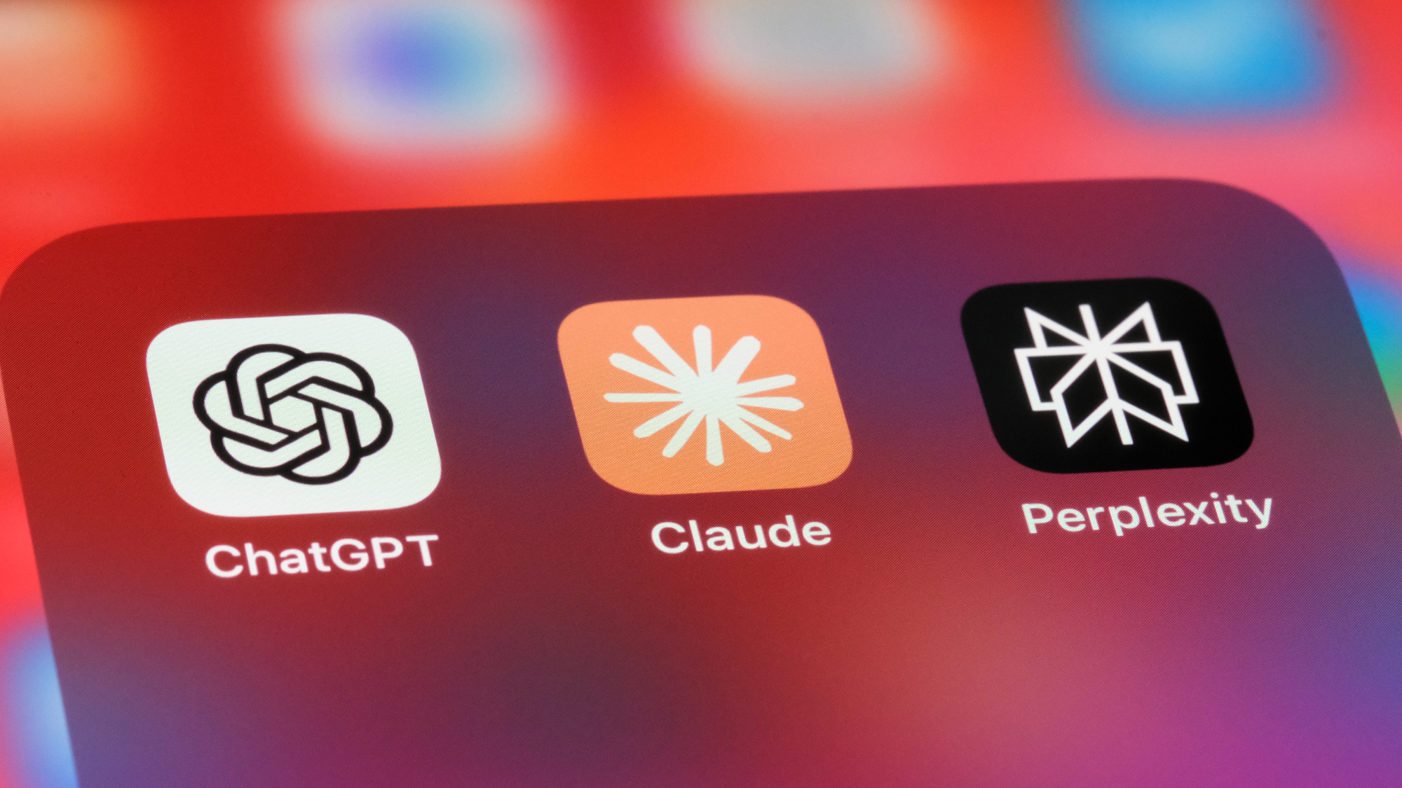 chatgpt claude and perplexity logo on an iPhone