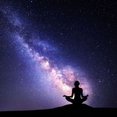 Workout based on star sign: A woman meditating by the stars