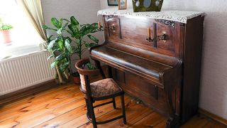 Old piano in a room 