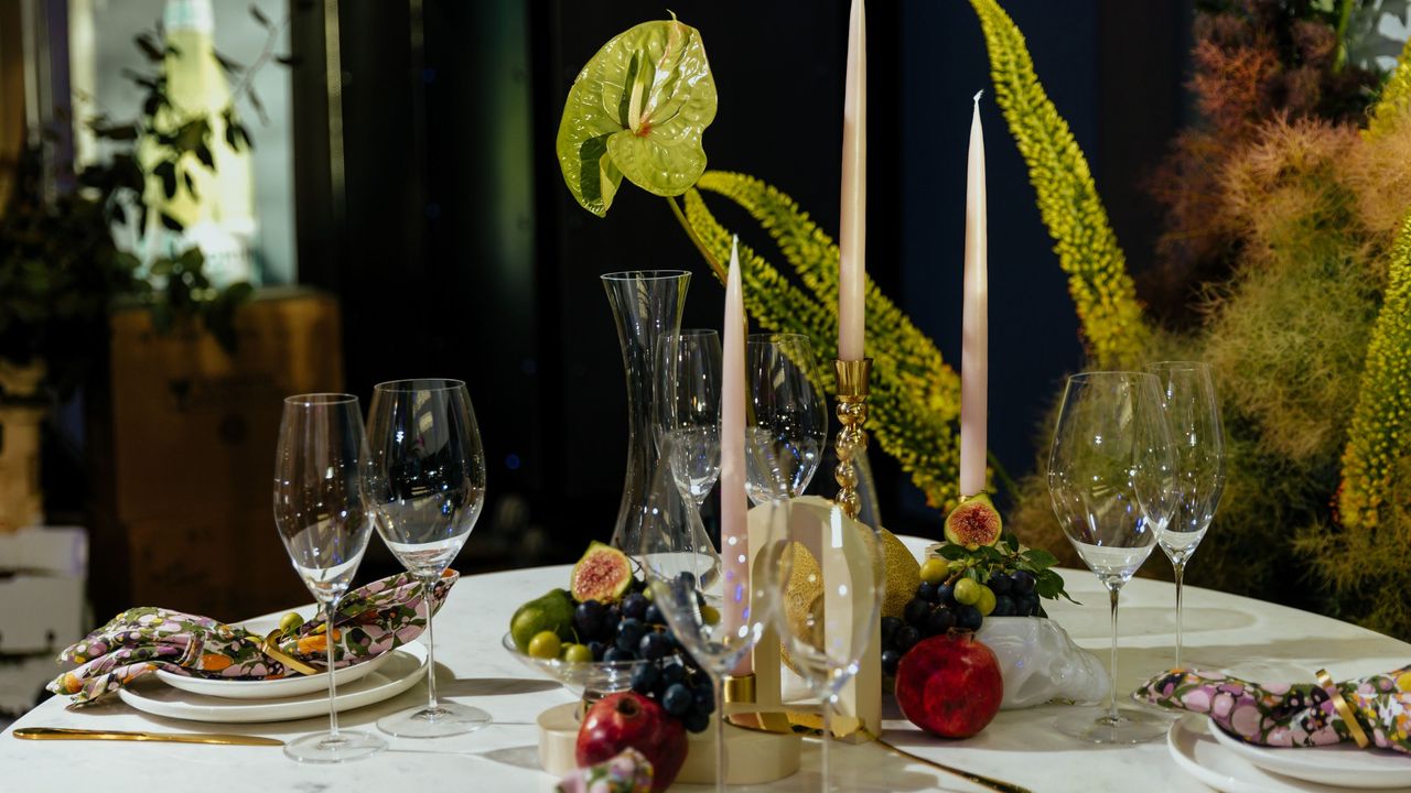 a table set for christmas with flowers