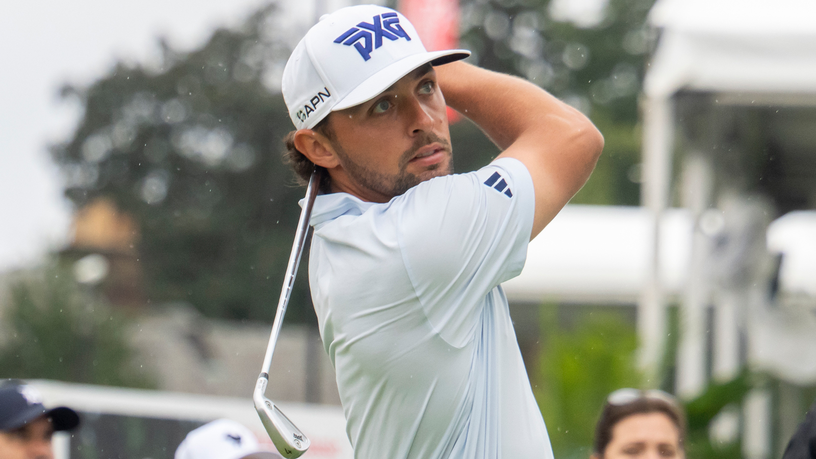Marco Penge hits an iron shot and watches it in the air