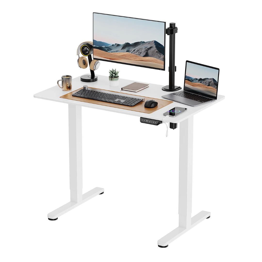 A small white standing desk with a monitor and keyboard setup
