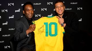 Brazil legend Pele and France icon Kylian Mbappe together in 2019.