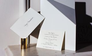 Several white card invites