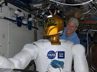 Astronaut Nyberg and Robonaut 2 in a Moment of Levity