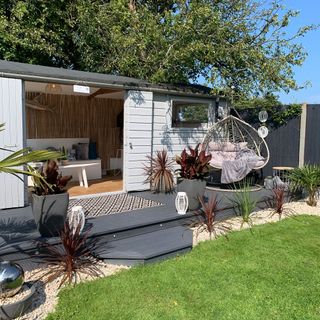 Raised hot tub in decking area of garden