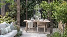 Outdoor dining area underneath a pergola