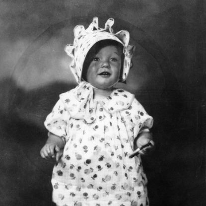 1928: Posing at two years old
