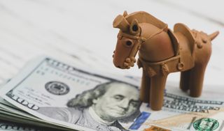 toy horse on dollar bills