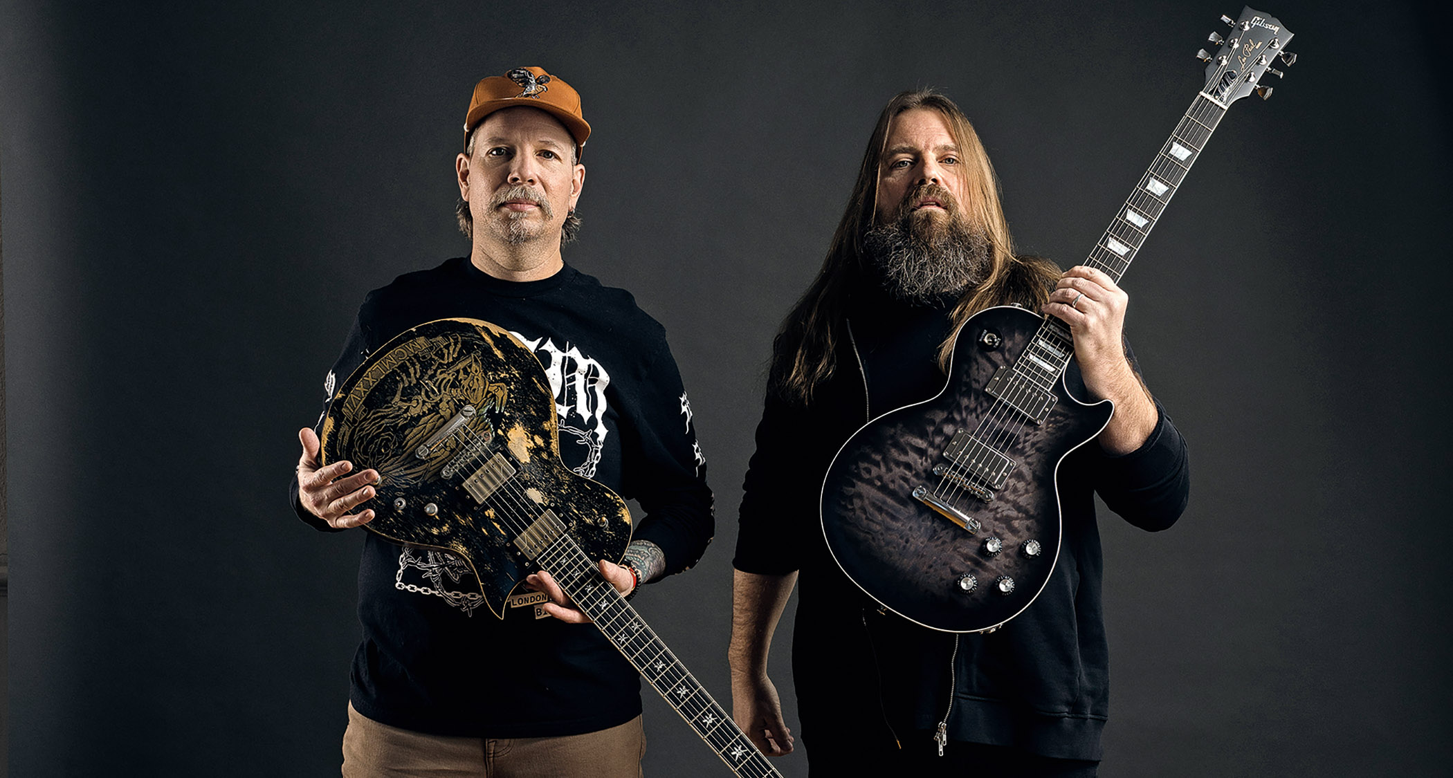 Willie Adler and Mark Morton of Lamb of God are photographed with their signature ESP and Gibson guitars respectively.