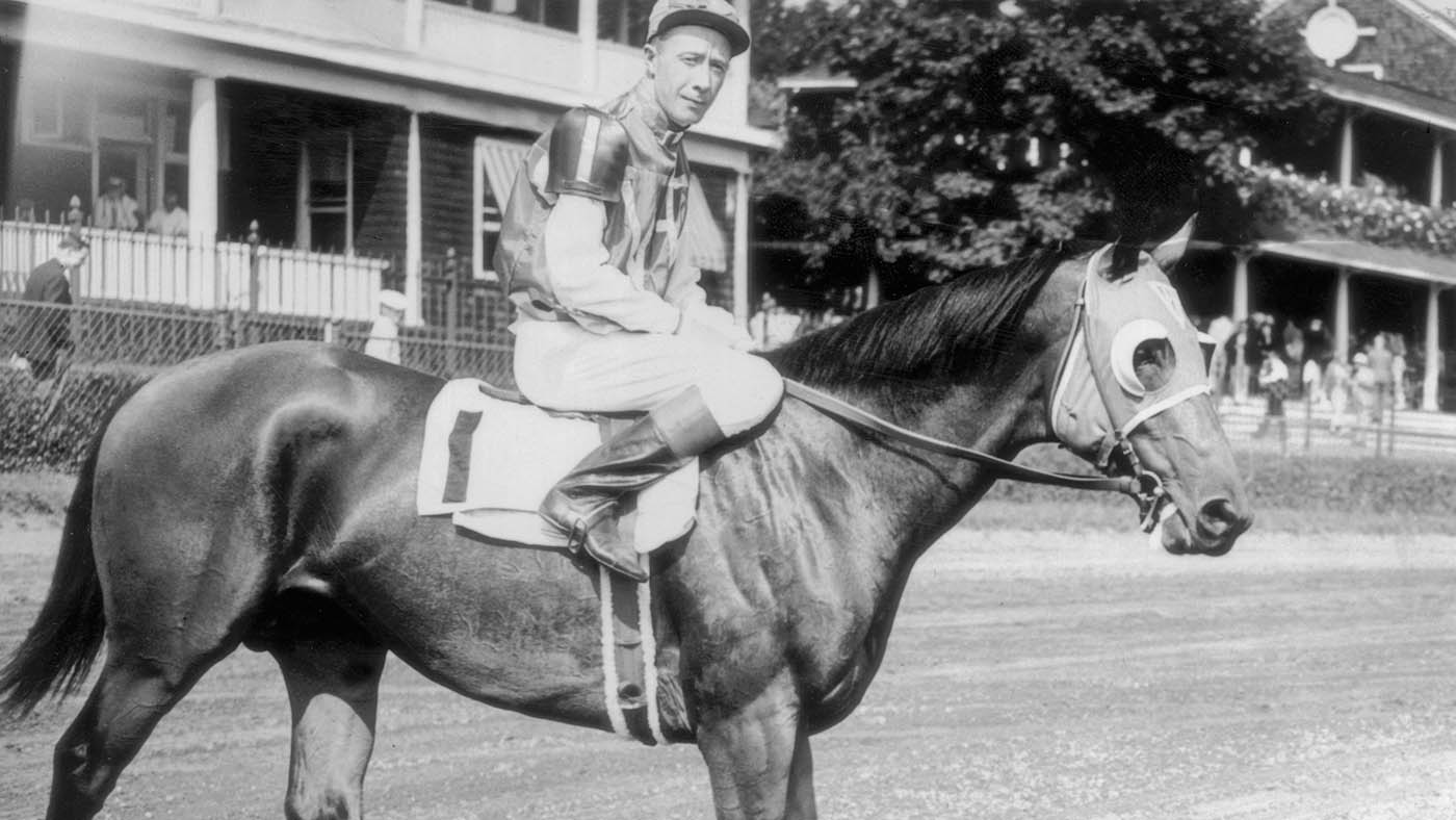 circa 1937: Famous American racehorse 'Seabiscuit' with one eyed jockey Johnny 'Red' Pollard. (Photo by Keystone/Getty Images)