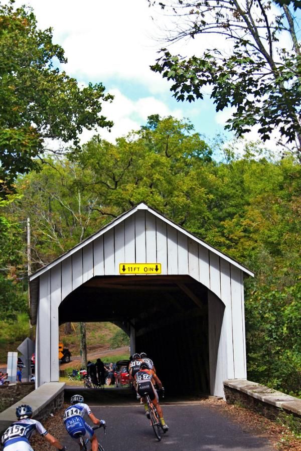 The peloton enters one of two covered bridges during the race.