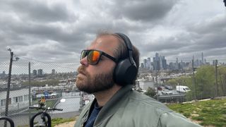 The Sony WH-1000XM5 being worn by Tom's Guide's Ryan Epps.