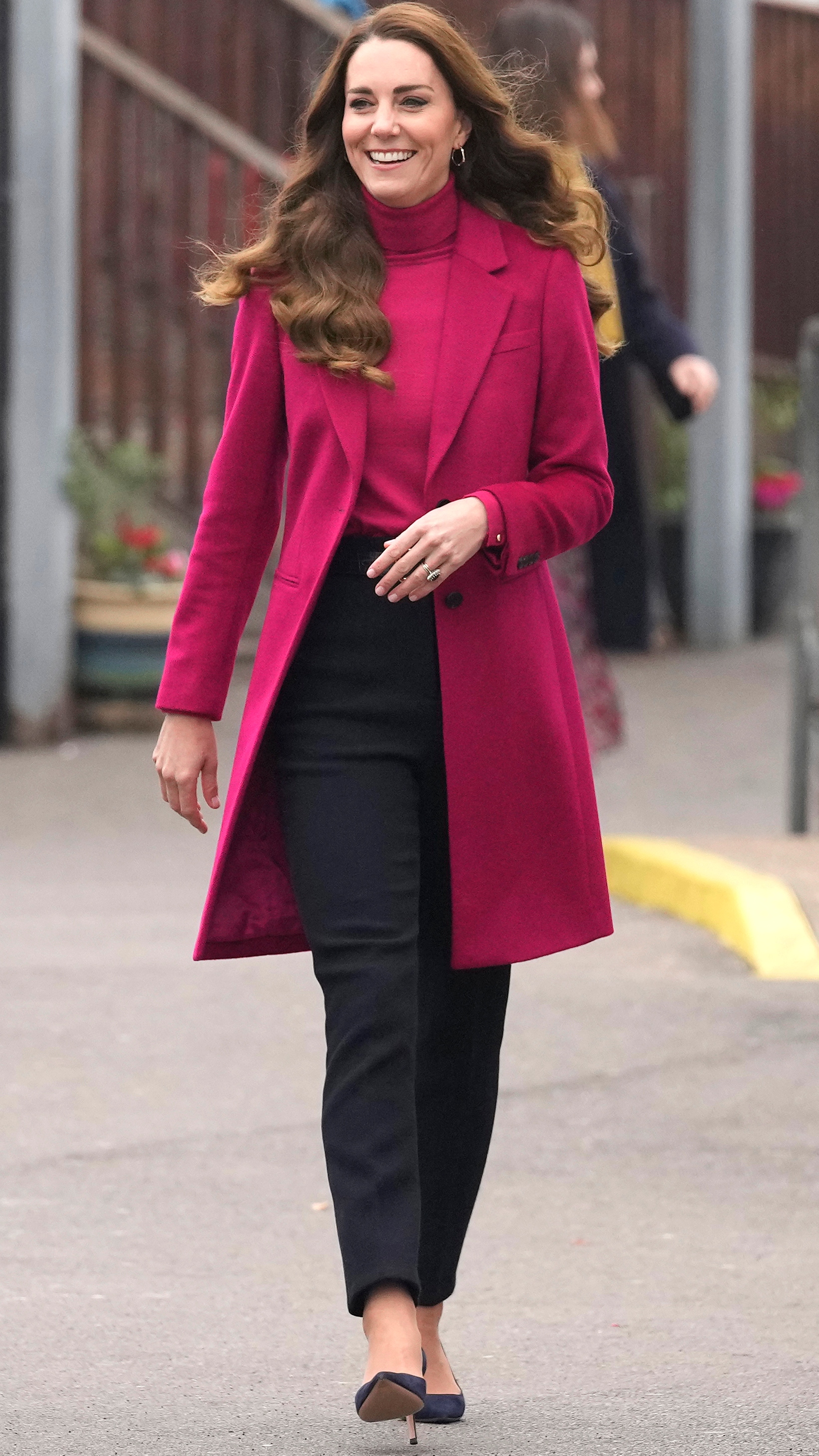 The Princess of Wales smiles as she arrives for a visit to Nower Hill High School on November 24, 2021