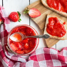 Strawberry jam with toast and gingham cloth