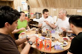 Members of the Mars500 crew share a meal together.