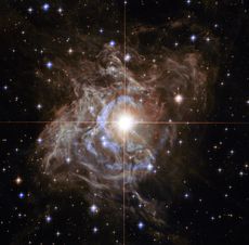 A cepheid in the Milky Way, RS Puppis, is seen through the Hubble Space Telescope.