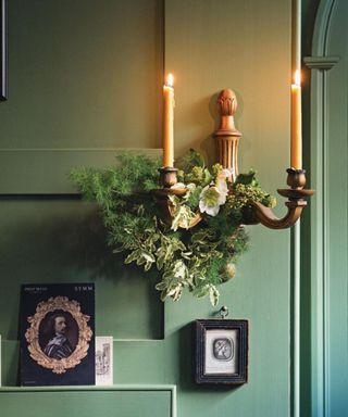 Green panelled room: Sconce, vintage photographs