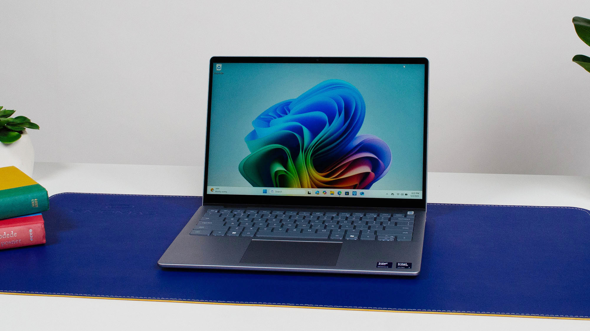 Dell 14 Plus 2-in-1 laptop on a blue mat