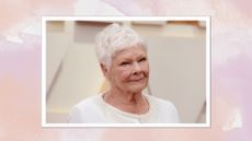 Judi Dench smiling with a grey pixie cut and wearing an embellished white jacket, on a pink and purple watercolour background