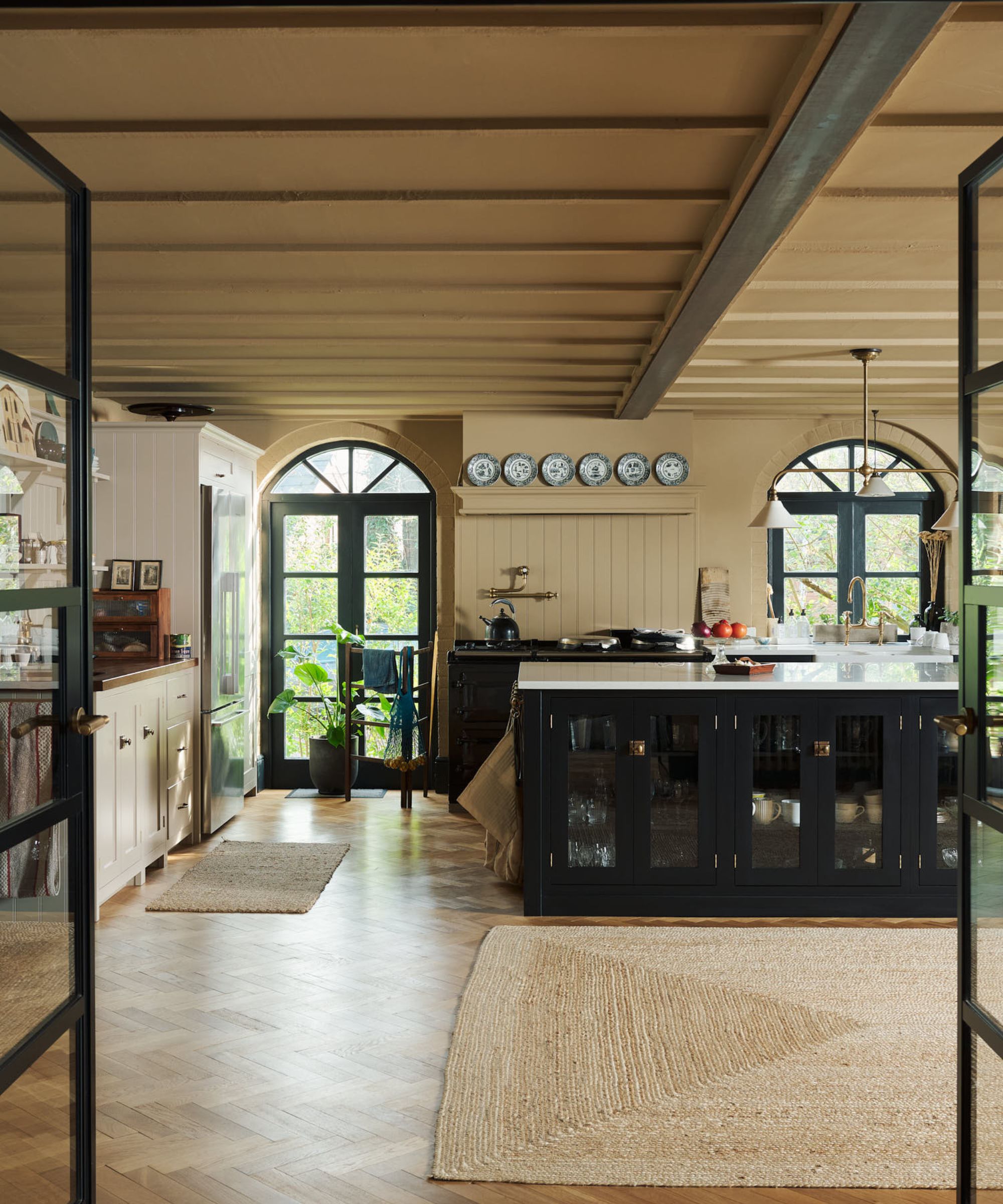 A traditional kitchen with a mix of dark and light cabinetry