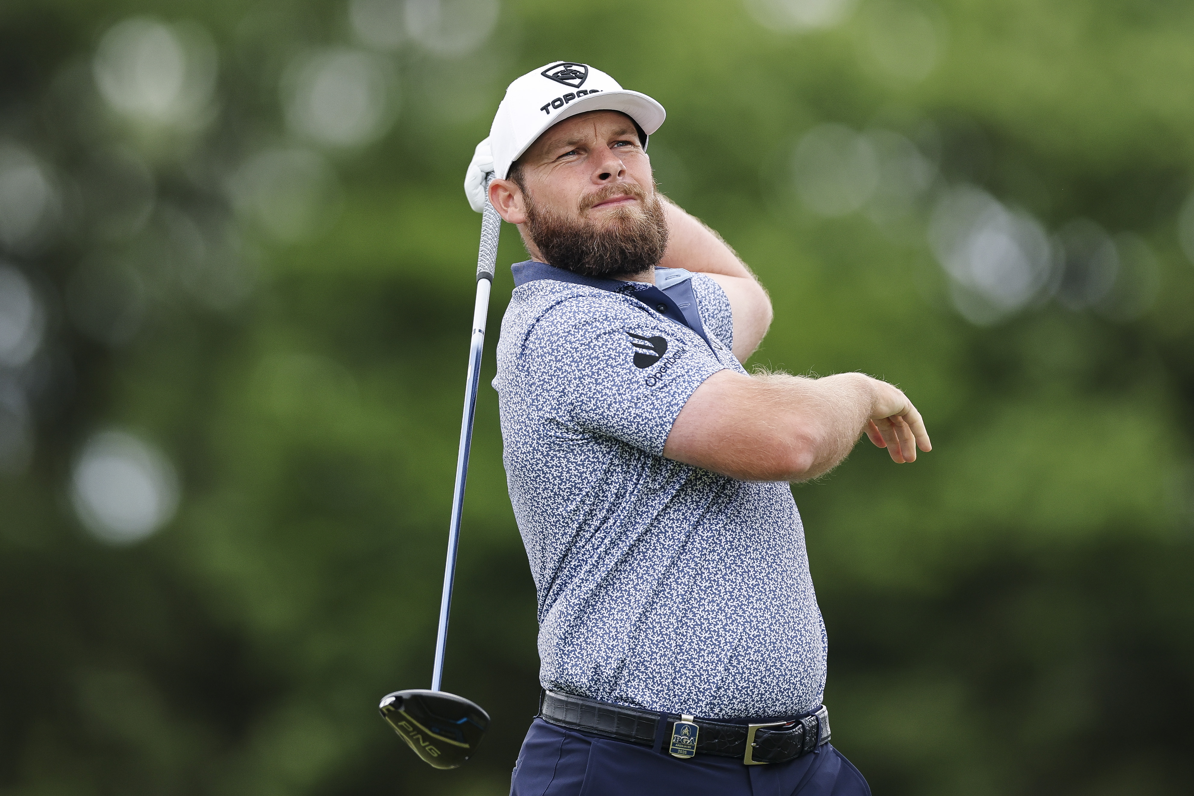 Tyrrell Hatton takes a hand off his club on a driver shot finish