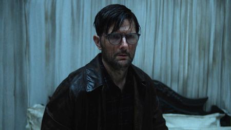 Adam Scott looking scared in Hokum