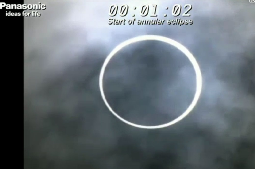 The moon blots out the sun in an annular solar eclipse as seen from the base camp of Mt. Fuji in Japan