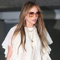 Jennifer Lopez was spotted in a boho Chloé blouse, wide-leg jeans, and an Hermès Birkin bag