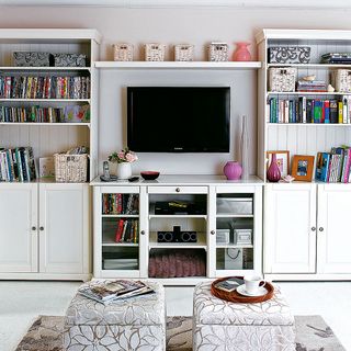 room with tv and shelves