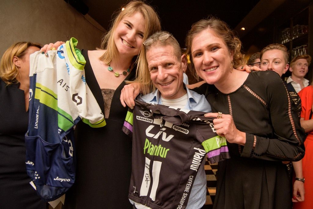 Loren Rowney and Carlee Taylor with the winner of their auction items