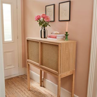Pink hallway with wooden console