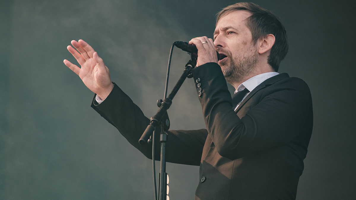 PORTSMOUTH, ENGLAND - AUGUST 26: Neil Hannon from The Divine Comedy performs at Victorious Festival 2023 at Southsea Common on August 26, 2023 in Portsmouth, England. (Photo by Rob Ball/Getty Images)