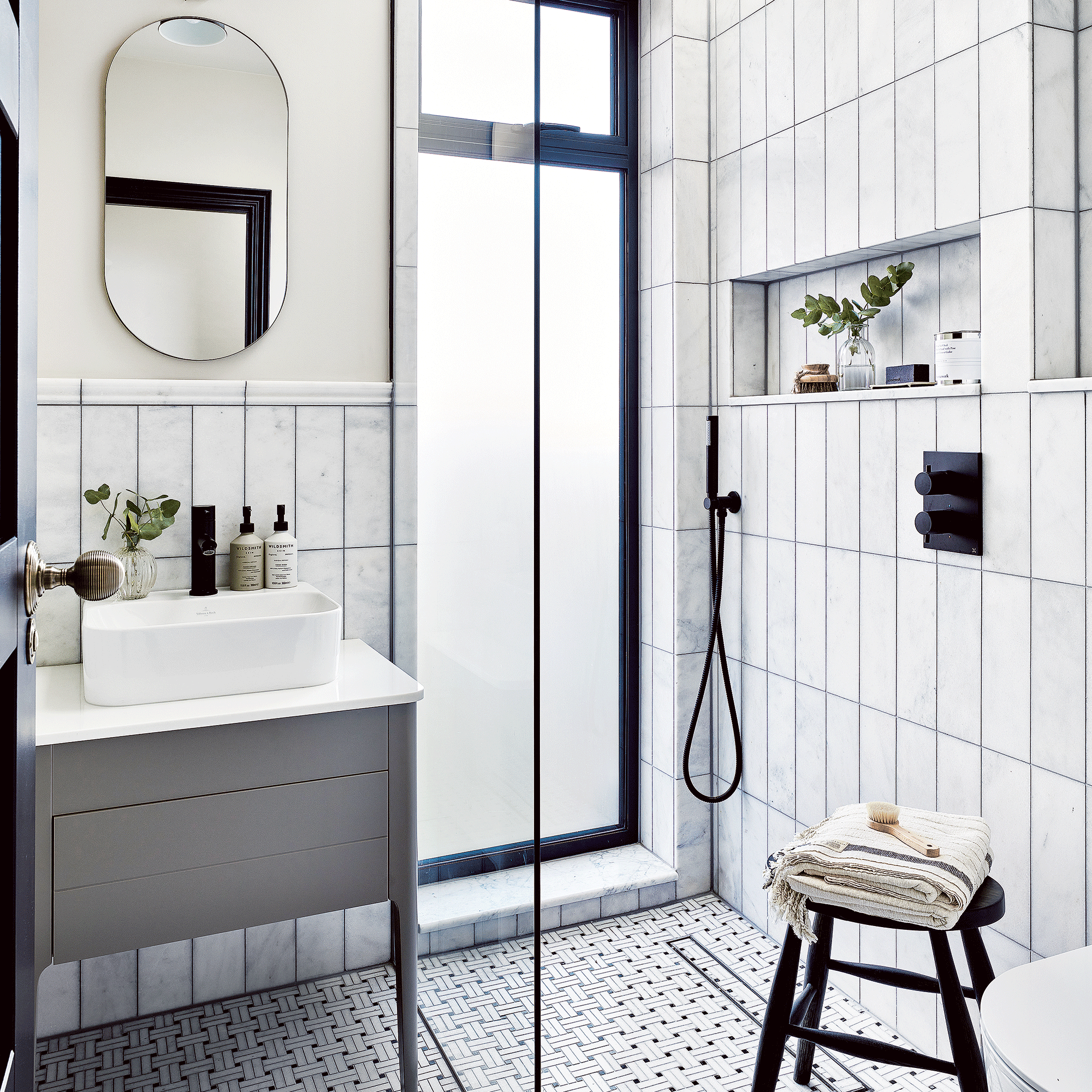 Bathroom with white tiles and grey vanity