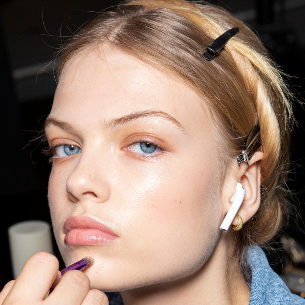 model backstage with glowing skin