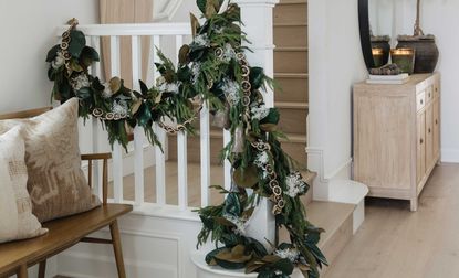 an entryway with a christmas garland