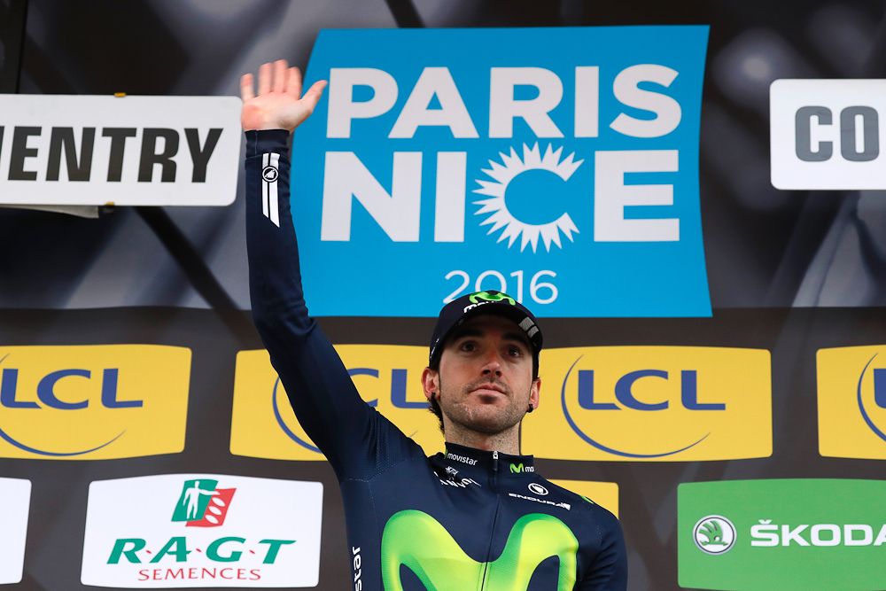 Jon Izagirre celebrates on the podium after being designated top climber