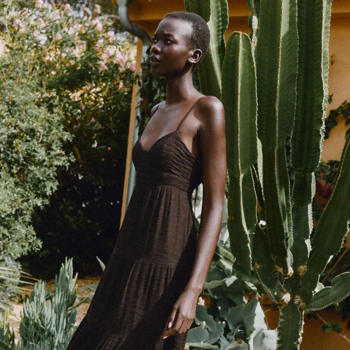 Woman wears brown dress