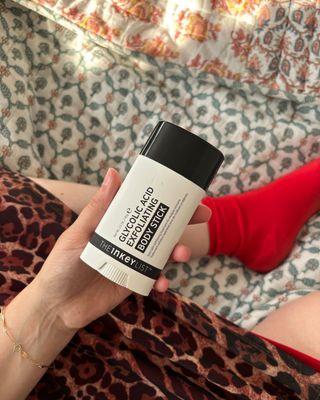 Mica Ricketts holding The Inkey List Glycolic Acid Exfoliating Body Stick