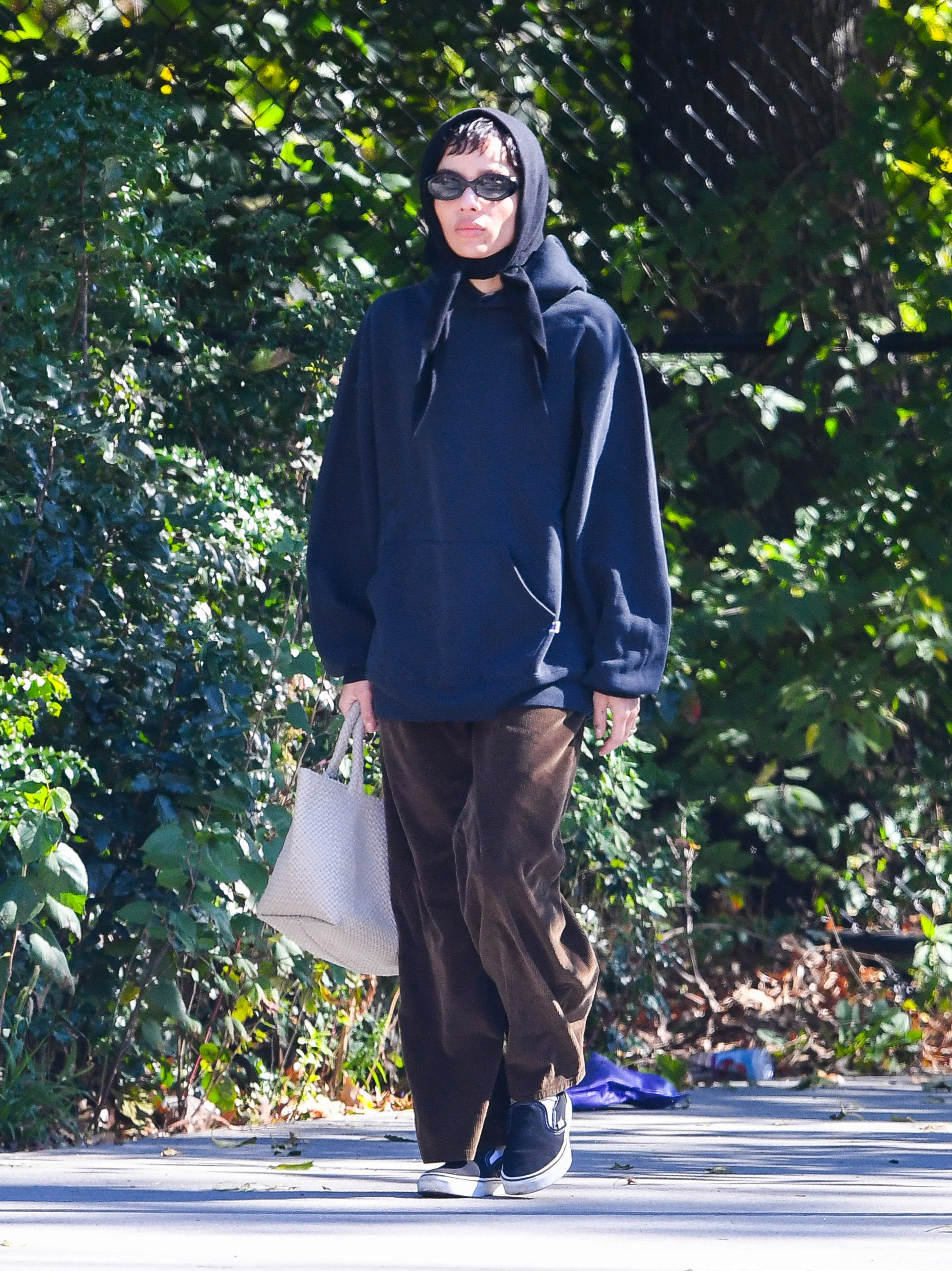Zoë Kravitz was spotted in NYC wearing corduroy pants, a knit head scarf, and Vans sneakers