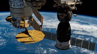 A U.S. Cygnus cargo spacecraft and a Russian Soyuz crew capsule both docked to the International Space Station in 2020.