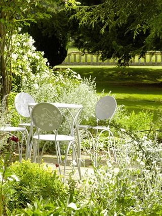 White outdoor table & chairs